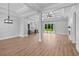 Open-concept living room featuring hardwood floors, large windows, and modern finishes at 3220 Highway 19, Conway, SC 29526