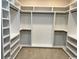 Large walk-in closet with custom shelving and hanging rods at 3220 Highway 19, Conway, SC 29526