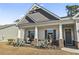 Front porch with wicker chairs and landscaping at 417 Rowells Ct., Conway, SC 29526