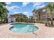 Community pool with surrounding patio furniture at 4271 Hibiscus Dr. # 201, Little River, SC 29566