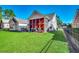 Spacious backyard with screened porch and lush lawn at 4280 Doral Pl., Myrtle Beach, SC 29579