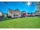 Large backyard with home and screened porch view at 4280 Doral Pl., Myrtle Beach, SC 29579