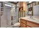 Bathroom with shower/tub combo and wood cabinets at 4280 Doral Pl., Myrtle Beach, SC 29579