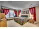 King-size bedroom with large windows and Southwestern decor at 4280 Doral Pl., Myrtle Beach, SC 29579