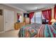 Bedroom with king-size bed, dresser, and large windows at 4280 Doral Pl., Myrtle Beach, SC 29579