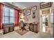 Bright home office with desk, chair, and view into hallway at 4280 Doral Pl., Myrtle Beach, SC 29579