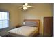 Well-lit bedroom with a bed, ceiling fan and a large window offering natural light and view at 4870 Dahlia Ct. # 303, Myrtle Beach, SC 29577