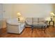 Bright living room with hardwood floors and comfortable seating, perfect for relaxation and entertaining at 4870 Dahlia Ct. # 303, Myrtle Beach, SC 29577