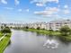 Aerial view of community with lake and lush landscaping at 4891 Luster Leaf Circle # 101, Myrtle Beach, SC 29577