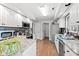 Spacious kitchen with granite countertops, stainless steel appliances, and white cabinets at 49 Bayberry Circle, Carolina Shores, NC 28467