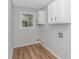 Laundry room with upper cabinets and vinyl flooring at 494 Saluda River Rd., Myrtle Beach, SC 29588