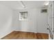 Unfinished basement space with hardwood floors, window, and exterior door access at 504 21St Ave. N, North Myrtle Beach, SC 29582