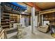 Unfinished basement features wood paneled walls, refrigerator, open shelving, overhead storage, and seating area at 504 21St Ave. N, North Myrtle Beach, SC 29582