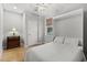 Neutral bedroom featuring murphy bed, side table, window with blind, and ceiling fan at 504 21St Ave. N, North Myrtle Beach, SC 29582