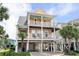 Charming raised beach home featuring double balconies, ground floor parking, and beachside access at 504 21St Ave. N, North Myrtle Beach, SC 29582