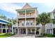 Stunning coastal home featuring multiple balconies, ample parking, and lush tropical landscaping at 504 21St Ave. N, North Myrtle Beach, SC 29582