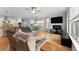 Spacious living room with hardwood floors, ceiling fan, and large windows for ample natural light at 504 21St Ave. N, North Myrtle Beach, SC 29582