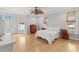 Spacious main bedroom featuring a ceiling fan, wood floors, and a dresser at 504 21St Ave. N, North Myrtle Beach, SC 29582