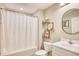 Clean bathroom with white vanity, shower/tub combo and decorative shelving at 520 Hobie Cat Rd., Myrtle Beach, SC 29588