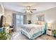 Cozy bedroom with a queen bed, ceiling fan, and plenty of natural light at 520 Hobie Cat Rd., Myrtle Beach, SC 29588