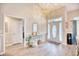 Bright and airy entryway with an elegant front door, hardwood floors, and tasteful decor at 520 Hobie Cat Rd., Myrtle Beach, SC 29588