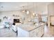 Modern kitchen features a large island, granite countertops, and open living space at 520 Hobie Cat Rd., Myrtle Beach, SC 29588