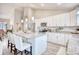 Open concept kitchen with granite island, stainless steel appliances, and white cabinets at 520 Hobie Cat Rd., Myrtle Beach, SC 29588