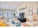 Spacious living area featuring a cozy seating arrangement and access to a patio at 520 Hobie Cat Rd., Myrtle Beach, SC 29588