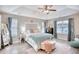 Large main bedroom with a king bed, stylish decor, and plenty of natural light at 520 Hobie Cat Rd., Myrtle Beach, SC 29588