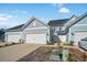 Two-story townhome with a two-car garage, well-manicured landscaping at 5371 Knobcone Loop # B, Myrtle Beach, SC 29577