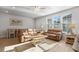 Bright living room with light brown leather couches and a coffee table at 5371 Knobcone Loop # B, Myrtle Beach, SC 29577