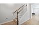 Stairs with a wooden handrail leading to the upper level at 5371 Knobcone Loop # B, Myrtle Beach, SC 29577