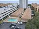 Overhead view of condo buildings, parking, and pool near the beach; some units have private patios at 5508 Porcher Dr. # 4, Myrtle Beach, SC 29577