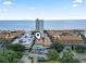 Wonderful aerial view of a condo community with a pool, parking, and ocean views at 5508 Porcher Dr. # 4, Myrtle Beach, SC 29577
