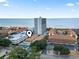 An aerial view showcases the condo location near the beach and community pool at 5508 Porcher Dr. # 4, Myrtle Beach, SC 29577