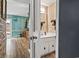 View through doorway into a bathroom with vanity and decor, adjacent to a living space at 5508 Porcher Dr. # 4, Myrtle Beach, SC 29577
