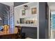 Open dining area features unique decor, stylish brick accent wall, and functional built-in serving area at 5508 Porcher Dr. # 4, Myrtle Beach, SC 29577