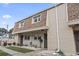 Townhouse exterior featuring brick and siding, with a tidy walkway and garden area at 5508 Porcher Dr. # 4, Myrtle Beach, SC 29577