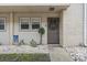 Charming front entrance with a decorative wreath, small plants, and pea gravel landscaping at 5508 Porcher Dr. # 4, Myrtle Beach, SC 29577
