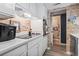 Well-maintained kitchen features modern appliances, bright countertops, and brick accents at 5508 Porcher Dr. # 4, Myrtle Beach, SC 29577