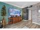 Cozy living room with wood-look flooring, a large TV, and stylish decor at 5508 Porcher Dr. # 4, Myrtle Beach, SC 29577