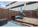 Outdoor patio featuring a wooden fence, stylish furniture, and rock accents at 5508 Porcher Dr. # 4, Myrtle Beach, SC 29577