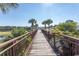 Charming wooden footbridge with metal railings over a canal at 567 Woodholme Dr., Conway, SC 29526