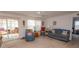 Spacious living room featuring a cozy seating area and sliding glass doors leading to the outdoors at 567 Woodholme Dr., Conway, SC 29526