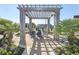 Relaxing pergola with seating area near the pool at 567 Woodholme Dr., Conway, SC 29526