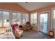 Bright sunroom with ample seating and backyard access at 567 Woodholme Dr., Conway, SC 29526