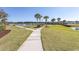 Enjoy a leisurely stroll along the community's paved walkways, with lush landscaping and water features at 567 Woodholme Dr., Conway, SC 29526