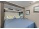 Comfortable bedroom with a queen bed and coastal decor at 6001 - 8047 S Kings Hwy., Myrtle Beach, SC 29575