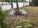 Fire pit with four chairs in grassy backyard at 6001 - 8047 S Kings Hwy., Myrtle Beach, SC 29575