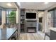 Living room with fireplace, TV, and built-in shelving at 6001 - 8047 S Kings Hwy., Myrtle Beach, SC 29575